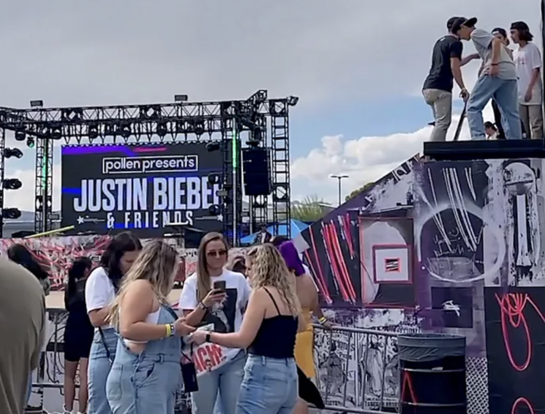 A Pollen festival crowd in front of a ‘pollen presents Justin Bieber & Friends’ stage